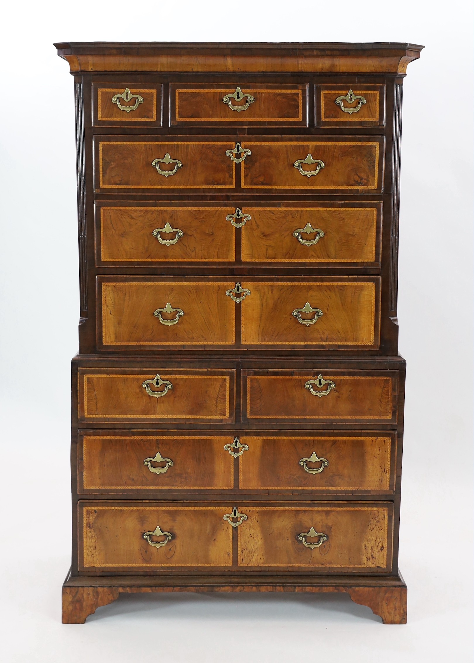 A George II featherbanded walnut chest on chest, width 100cm, depth 51cm, height 165cm